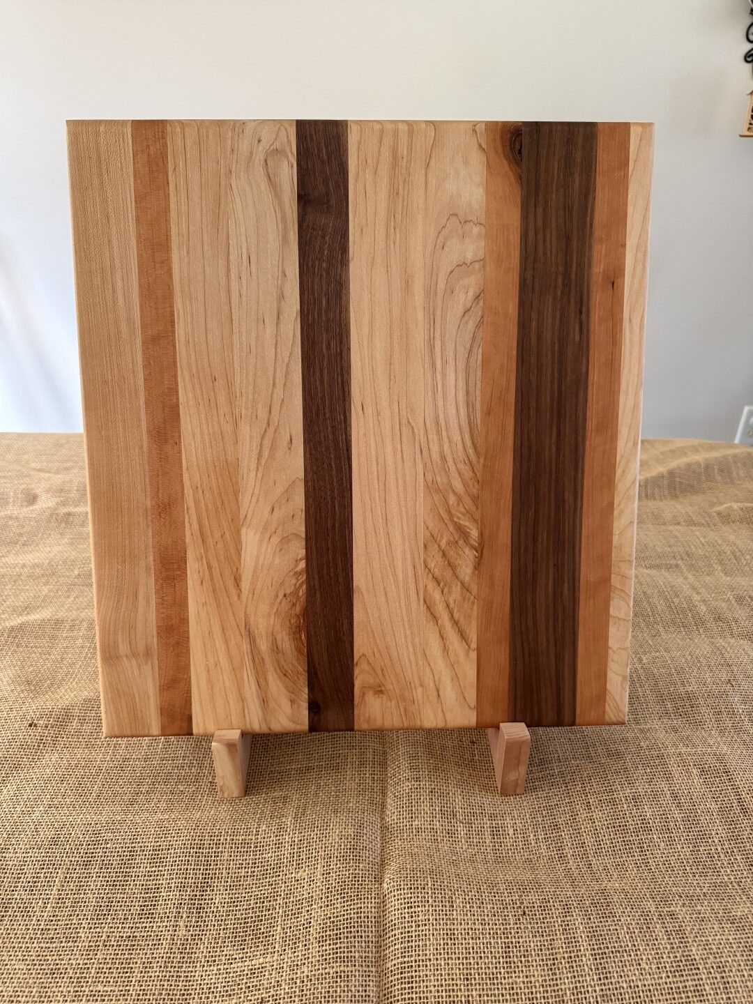 16” x 17” cutting board, made of black walnut, cherry, and maple, is ideal for smaller spaces. - Image 3