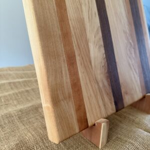 16” x 17” cutting board, made of black walnut, cherry, and maple, is ideal for smaller spaces.
