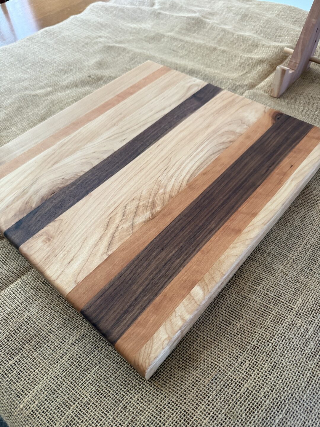 16” x 17” cutting board, made of black walnut, cherry, and maple, is ideal for smaller spaces. - Image 2